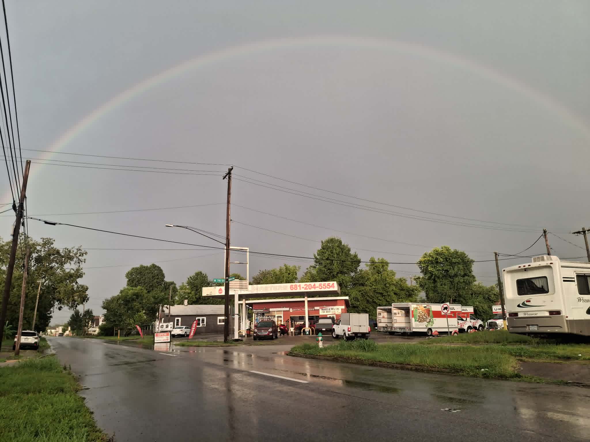 Detail Masters shop with a rainbow overhead