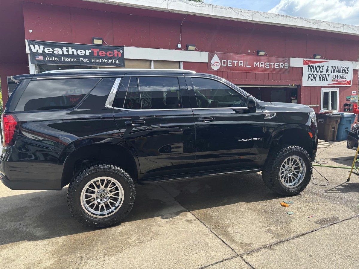Detailed black GMC Yukon at Detail Masters
